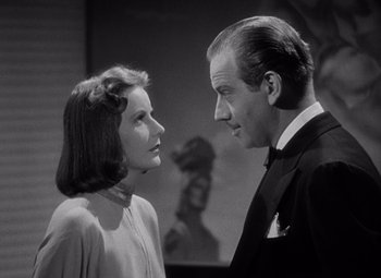 Movie still from “Ninotchka” (1939), directed by Ernst Lubitsch – A man and a woman standing next to each other; Close Up shot, Low angle