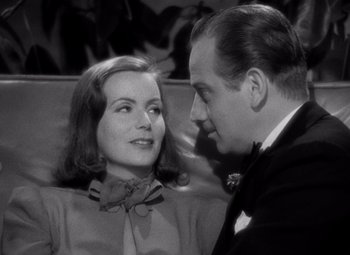 Movie still from “Ninotchka” (1939), directed by Ernst Lubitsch – A man and a woman looking at one another; Close Up shot, Over the shoulder angle