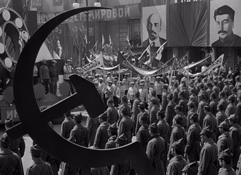 Movie still from “Ninotchka” (1939), directed by Ernst Lubitsch – A large crowd of people are gathered together; Wide shot, High angle