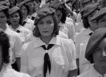 Movie still from “Ninotchka” (1939), directed by Ernst Lubitsch – Black and white photograph of women in military uniforms; Medium shot, High angle