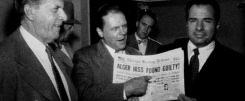 Movie still from “Nixon” (1995), directed by Oliver Stone – An old photo of a man reading a newspaper; Medium shot, Over the shoulder angle