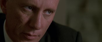 Movie still from “Nixon” (1995), directed by Oliver Stone – A man's eyes and face; Close Up shot, Low angle