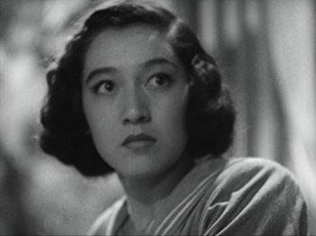 Movie still from “No Regrets for Our Youth” (1946), directed by Akira Kurosawa – An old black and white photo of a woman; Close Up shot, Low angle
