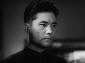 Movie still from “No Regrets for Our Youth” (1946), directed by Akira Kurosawa – A young man in a black and white photo; Close Up shot, Low angle