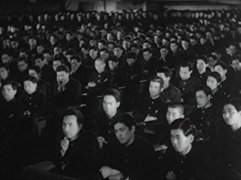 Movie still from “No Regrets for Our Youth” (1946), directed by Akira Kurosawa – A group of people sitting in a room; Wide shot, High angle