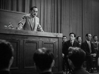 Movie still from “No Regrets for Our Youth” (1946), directed by Akira Kurosawa – An old photo of a man giving a speech; Medium shot, Low angle