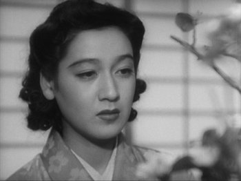 Movie still from “No Regrets for Our Youth” (1946), directed by Akira Kurosawa – An old photo of an asian woman looking at the camera; Close Up shot, High angle