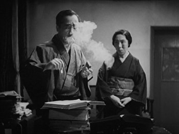 Movie still from “No Regrets for Our Youth” (1946), directed by Akira Kurosawa – An older man and a younger woman in traditional garb; Medium shot, Low angle