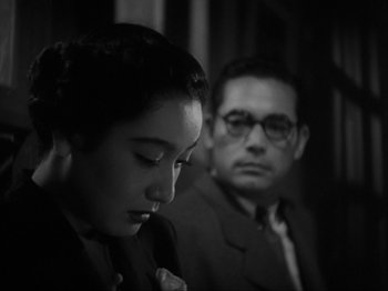 Movie still from “No Regrets for Our Youth” (1946), directed by Akira Kurosawa – A man and a woman sitting next to each other; Close Up shot, Over the shoulder angle