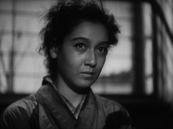 Movie still from “No Regrets for Our Youth” (1946), directed by Akira Kurosawa – A black - and - white photo of a woman in a kimono; Close Up shot, Low angle