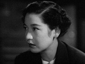 Movie still from “No Regrets for Our Youth” (1946), directed by Akira Kurosawa – An old photo of an asian woman looking to her left; Close Up shot, High angle