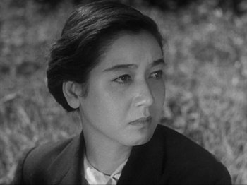 Movie still from “No Regrets for Our Youth” (1946), directed by Akira Kurosawa – A black - and - white photo of a woman looking at the camera; Close Up shot, High angle