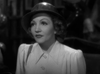 Movie still from “No Time for Love” (1943), directed by Mitchell Leisen – An older woman wearing a hat and a dress; Close Up shot, High angle