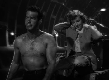 Movie still from “No Time for Love” (1943), directed by Mitchell Leisen – A man and a woman are standing next to each other; Medium shot, Low angle