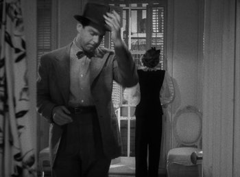 Movie still from “No Time for Love” (1943), directed by Mitchell Leisen – A black and white photo of a man and a woman; Medium shot, High angle