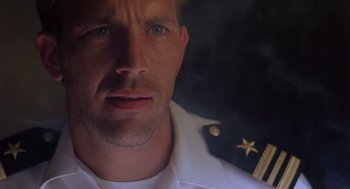 Movie still from “No Way Out” (1987), directed by Roger Donaldson – A person wearing a uniform; Close Up shot, Low angle