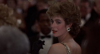 Movie still from “No Way Out” (1987), directed by Roger Donaldson – A person wearing a dress; Close Up shot, Over the shoulder angle