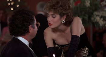 Movie still from “No Way Out” (1987), directed by Roger Donaldson – A man and a woman are talking to each other; Medium shot, Over the shoulder angle