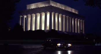 Movie still from “No Way Out” (1987), directed by Roger Donaldson – A car parked in front of the lincoln memorial at night; Extreme Wide shot, Low angle