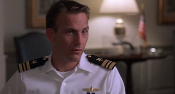 Movie still from “No Way Out” (1987), directed by Roger Donaldson – A person wearing a uniform; Close Up shot, Low angle