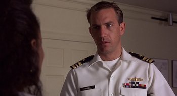 Movie still from “No Way Out” (1987), directed by Roger Donaldson – A person wearing a uniform; Close Up shot, Over the shoulder angle