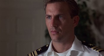 Movie still from “No Way Out” (1987), directed by Roger Donaldson – A person wearing a uniform; Close Up shot, Low angle