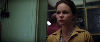 Movie still from “Norma Rae” (1979), directed by Martin Ritt – A woman standing in front of a window looking sad; Close Up shot, Low angle