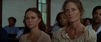 Movie still from “Norma Rae” (1979), directed by Martin Ritt – A group of people sitting in a room; Close Up shot, Low angle