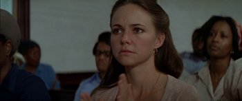 Movie still from “Norma Rae” (1979), directed by Martin Ritt – A person clapping her hands; Close Up shot, Over the shoulder angle