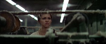 Movie still from “Norma Rae” (1979), directed by Martin Ritt – A woman in a boxing ring looking at the camera; Close Up shot, Low angle