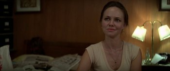 Movie still from “Norma Rae” (1979), directed by Martin Ritt – A woman sitting in front of a table with papers; Close Up shot, Over the shoulder angle