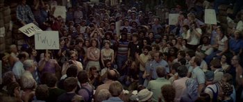 Movie still from “Norma Rae” (1979), directed by Martin Ritt – A large crowd of people gathered together for a rally; Wide shot, High angle