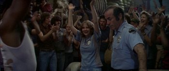 Movie still from “Norma Rae” (1979), directed by Martin Ritt – A group of people standing in front of a crowd; Medium shot, High angle