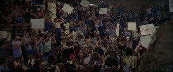 Movie still from “Norma Rae” (1979), directed by Martin Ritt – A crowd of people sitting and standing in a room; Wide shot, Overhead angle