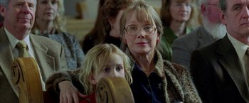 Movie still from “North Country” (2005), directed by Niki Caro – An older woman and a young girl are looking at the camera; Close Up shot, Over the shoulder angle
