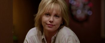 Movie still from “North Country” (2005), directed by Niki Caro – A person wearing a white shirt; Close Up shot, Over the shoulder angle