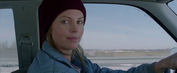 Movie still from “North Country” (2005), directed by Niki Caro – A person in a car looking at the camera; Close Up shot, Over the shoulder angle