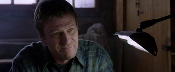 Movie still from “North Country” (2005), directed by Niki Caro – A person wearing a plaid shirt; Close Up shot, Over the shoulder angle