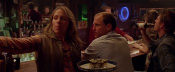 Movie still from “North Country” (2005), directed by Niki Caro – A man and a woman sitting at a table with drinks; Medium shot, Over the shoulder angle