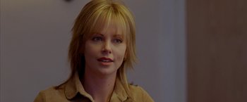 Movie still from “North Country” (2005), directed by Niki Caro – A person with blonde hair; Close Up shot, Over the shoulder angle