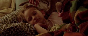 Movie still from “North Country” (2005), directed by Niki Caro – A little girl sleeping in a bed with a stuffed animal; Close Up shot, High angle