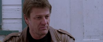 Movie still from “North Country” (2005), directed by Niki Caro – A person wearing a leather jacket; Close Up shot, Over the shoulder angle