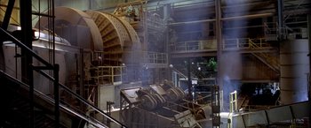 Movie still from “North Country” (2005), directed by Niki Caro – An industrial building with many machines inside of it; Extreme Wide shot, High angle