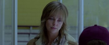 Movie still from “North Country” (2005), directed by Niki Caro – A person wearing a jacket; Close Up shot, Over the shoulder angle