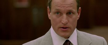 Movie still from “North Country” (2005), directed by Niki Caro – A man in a gray suit and a brown tie; Close Up shot, Low angle