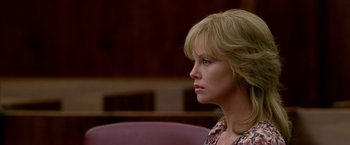 Movie still from “North Country” (2005), directed by Niki Caro – Charlize theron in a courtroom scene from the movie 't rue detective '; Close Up shot, Over the shoulder angle