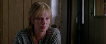 Movie still from “North Country” (2005), directed by Niki Caro – A person sitting in front of a window; Close Up shot, Over the shoulder angle