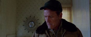 Movie still from “North Country” (2005), directed by Niki Caro – A person wearing a hat; Close Up shot, Over the shoulder angle