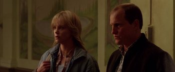 Movie still from “North Country” (2005), directed by Niki Caro – A man and a woman standing next to each other in a room; Close Up shot, Low angle