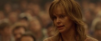 Movie still from “North Country” (2005), directed by Niki Caro – A person wearing a plaid shirt; Close Up shot, Over the shoulder angle